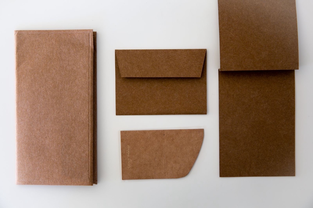 Kraft envelopes and folders laid out on a white surface
