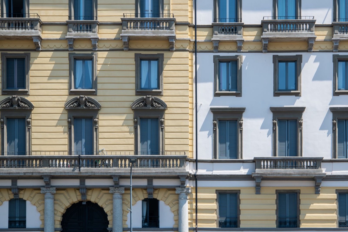A historic building facade on a street in Milan